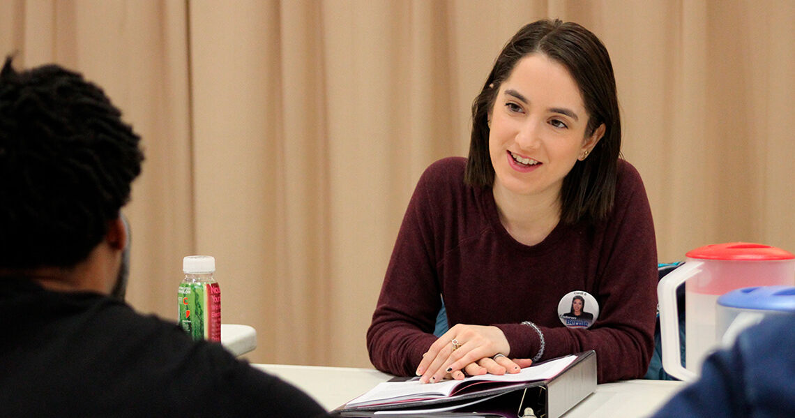 Image of Remy Zaken Andersen, owner and head tutor of Andersen Education, studies a play with her costar