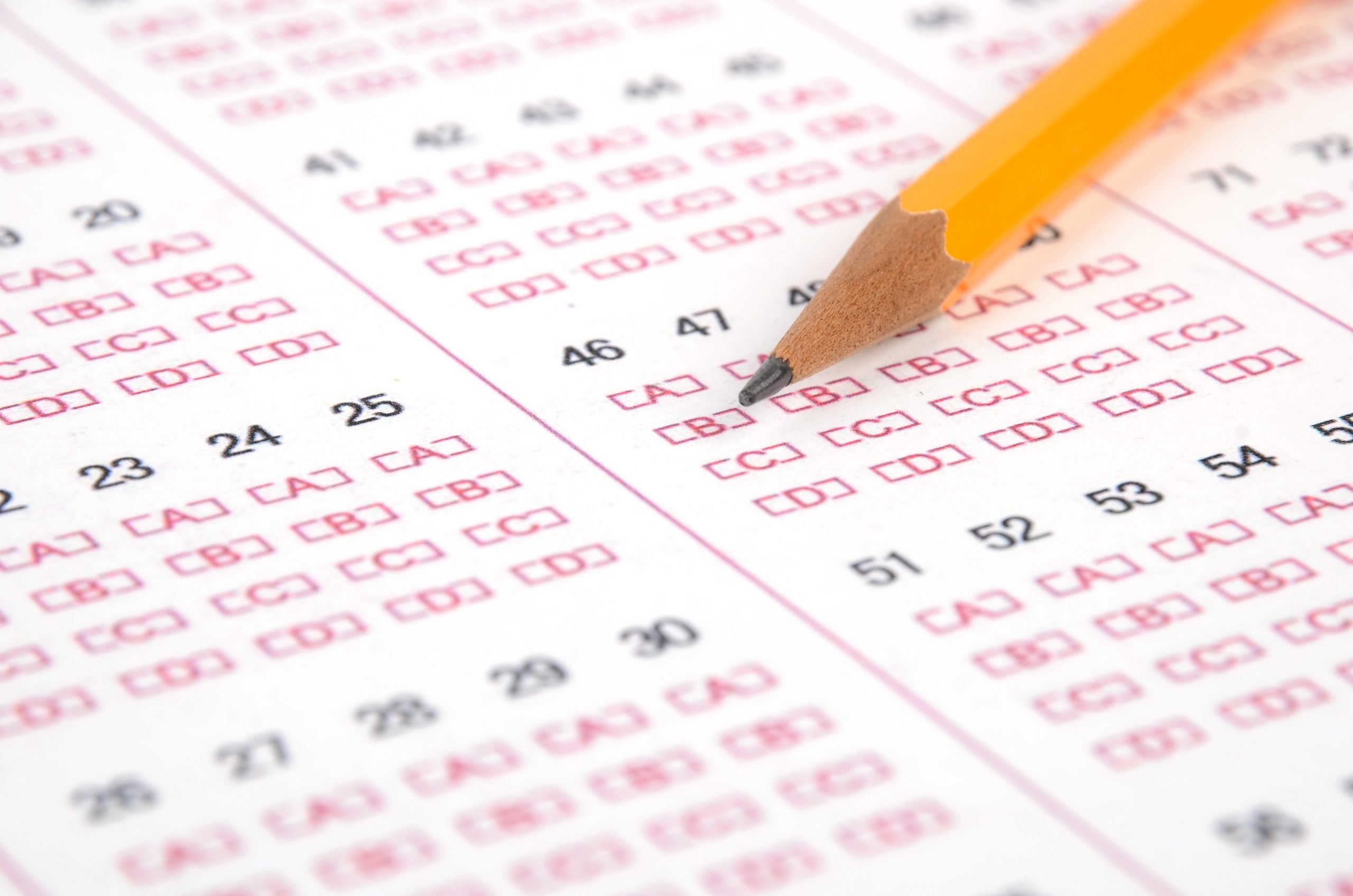 Test and pencil Pencil bubbling in a test answer sheet